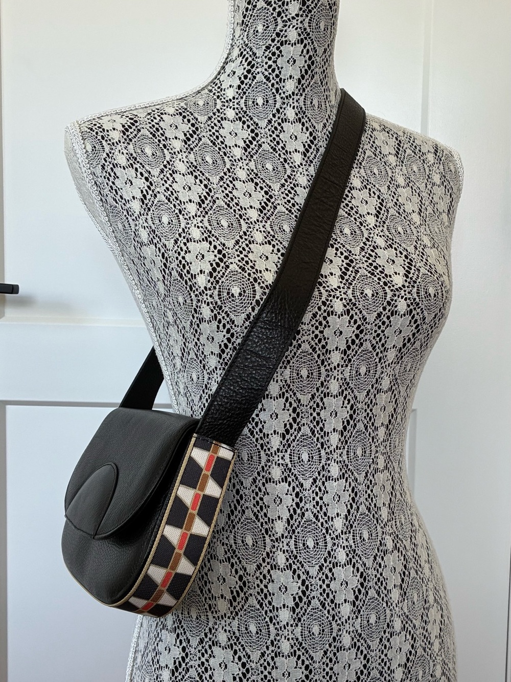 Malej Black Leather Crossbody Saddle Bag with Patterned Trim
